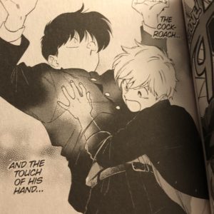 Photo of frame in which Hirose has his hand up Nakamura's shirt trying to find a cockroach